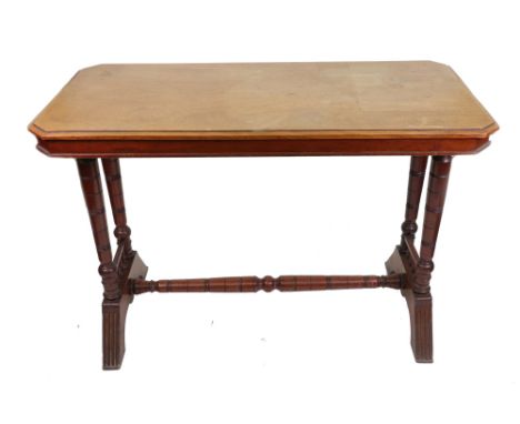 An Aesthetic period mahogany side table, with canted corner rectangular top, on dual ring turned end standards with downswept