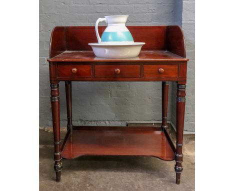 A Regency mahogany ebony banded two-tier washstand, with two frieze drawers, on ring turned legs, 83cm wide x 53cm deep x 102