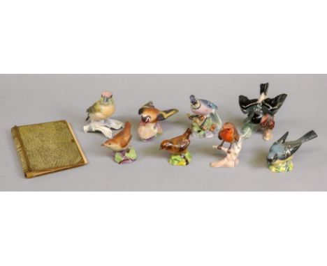 Two Goebel figures, one of a robin, another German figure of a bird, two Beswick birds and three Royal Worcester birds, also 