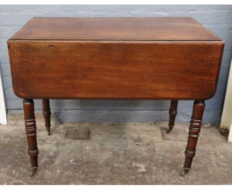 A late Regency mahogany Pembroke table, on ring turned legs and castors, 90cm wide x 53cm deep x 72cm high.