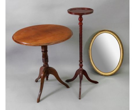 A George III and later mahogany pedestal table, the circular top on a ring turned pillar and tripod base, a George III style 