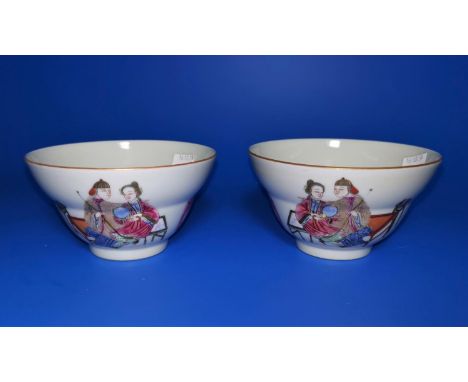 A pair of Chinese ceramic tea bowls with polychrome decoration and marks to base