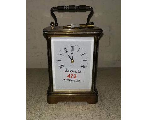 A striking carriage clock in brass case by Matthew Norman, London, height 5.5" 