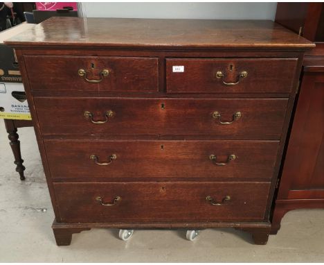 A mid Georgian oak chest of 3 long and 2 short drawers with brass swan neck handles, on bracket feet 