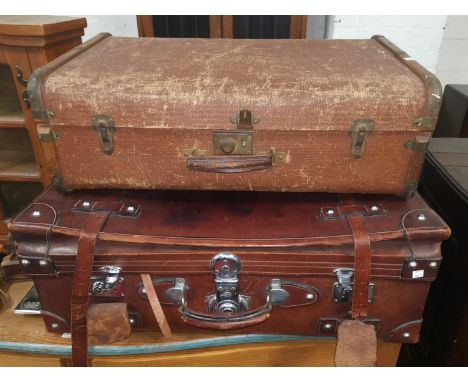 A vintage large leather suitcase with chrome metal fittings; a wood bound travel trunk 