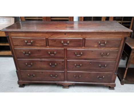 A late 18th/early 19th century mahogany Lancashire chest with hinged lid, side columns, 5 false drawer fascias over 4 drawers