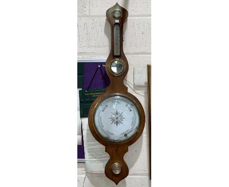 An aneroid barometer in oak banjo shaped case; another similar; 2others 
