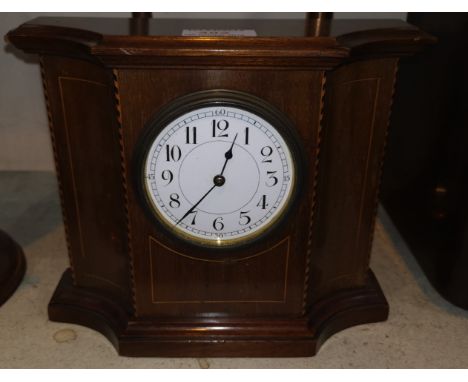 A mantel clock in mahogany cased with enamel dial and French movement 