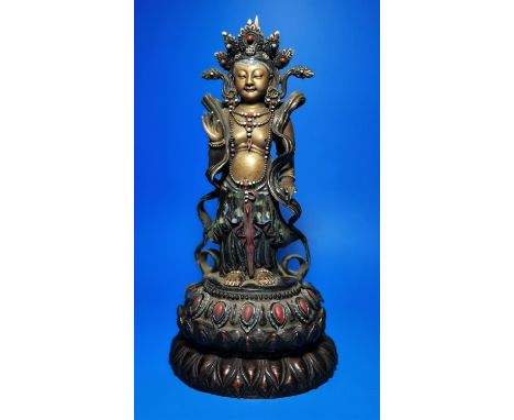 An oriental ceramic figure of Buddha decorated in gilt etc, on wooden stand