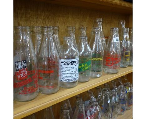 A shelf of 1980s advertising milk bottles, and various dairy bottles 