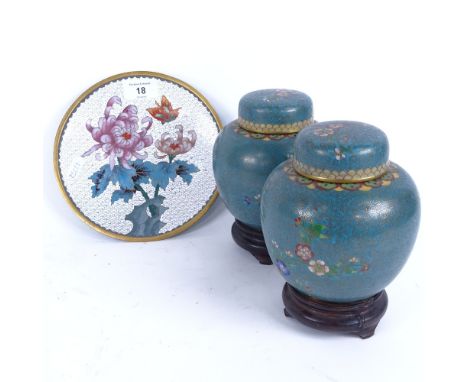 A pair of Chinese cloisonne enamel brass ginger jars and covers, and a similar plate, plate diameter 19cm (3) 