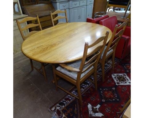 An Ercol "Southwold" honey elm oval dining table, L165cm, together with a set of 4 Ercol "Penn" chairs (2 and 2) 