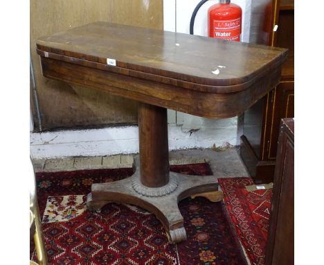 A Regency rosewood fold over card table, raised on barrel turned column and platform base, W92cm, H75cm 