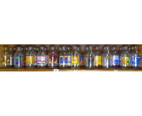 A shelf of 1980s advertising milk bottles 