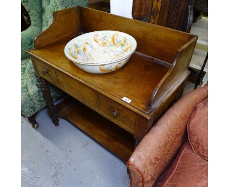 A Victorian mahogany washstand, with raised shaped gallery, short drawers with shelf below, on turned legs, and a Cauldon chi