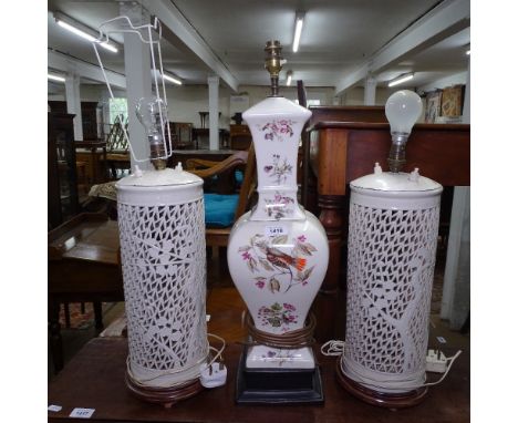 A pair of Oriental design Blanc-de-Chine table lamps with pierced bodies (central lamp is no longer included in this lot)