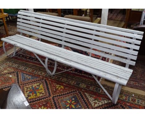 A Victorian hardwood slatted garden bench, on 3 scrolled wrought-iron legs, L250cm 