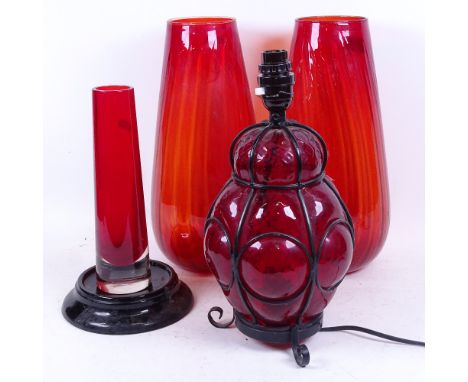 A pair of glass vases, 33cm, another, and wirework-cased red glass lamp 