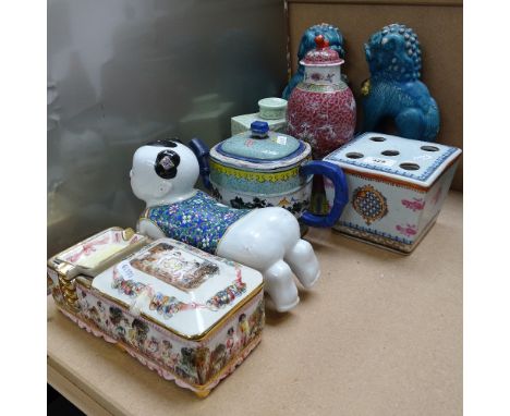 A pair of Chinese blue glaze Dogs of Fo, armorial brush pot, celadon glaze tea caddy etc 