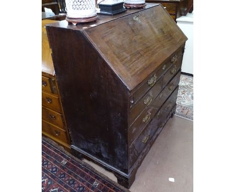 A George III mahogany bureau with a fitted interior, and 5 drawers under, on bracket feet, W100cm, H108cm 