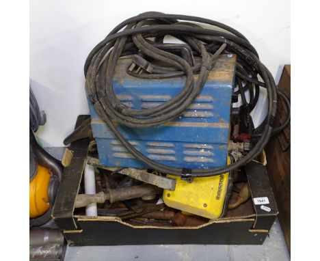 A welder, and a box of miscellaneous hand tools 