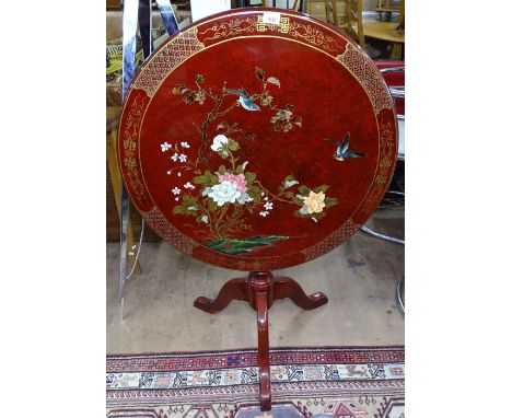An Oriental design red lacquered tilt-top table, on tripod base, W76cm 