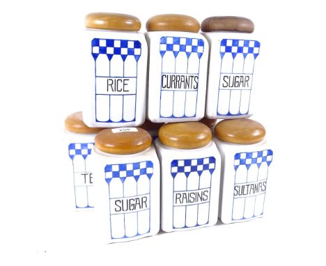 A set of 9 German Art Deco ceramic kitchen storage jars, 7 marked Felix, with turned wood lids, height 17cm 