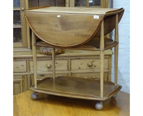 An Ercol elm 3-tier drop leaf tea trolley, W74cm, H75cm 