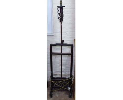 A Chinese padauk wood standard lamp, with carved and pierced panel decoration, H142cm 