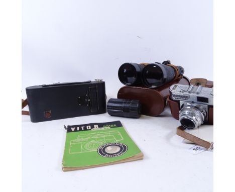 Leather-cased Hensoldt binoculars, a Voigtlander camera, and a Kodak leather-cased folding camera 