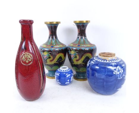 A pair of Chinese cloisonne enamel vases, blue and white prunus pattern ginger jar, and a red glazed narrow-neck Studio potte