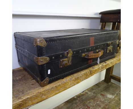 A Vintage steel-bound travelling steamer trunk, with fitted interior 