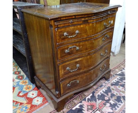 A reproduction cross-banded mahogany bachelor's chest of serpentine form, with brushing slide and 4 long drawers, on bracket 