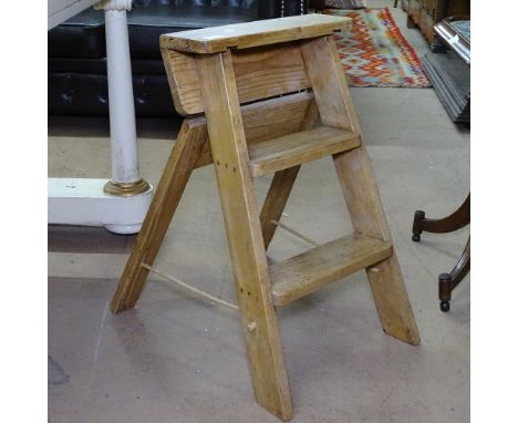 A small 3-step folding pine ladder 