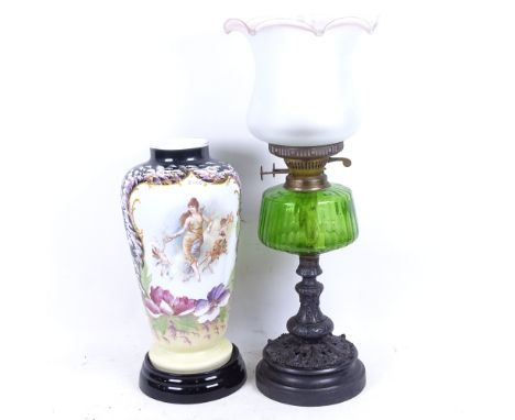 A Victorian oil lamp with green glass font, 59cm, and a painted Edwardian glass vase on stand 