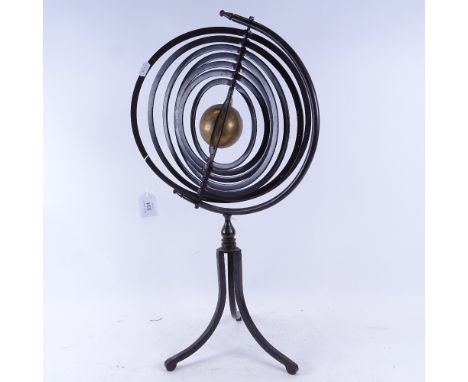A Vintage modernist celestial wrought-iron and brass armillary sphere, on folding tripod base, height 63cm 