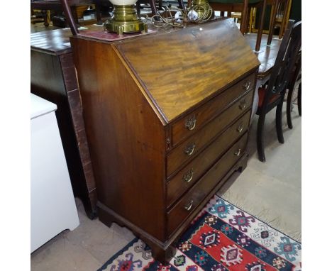 A George II mahogany bureau, fall-front revealing a drawer and pigeon hole fitted interior, 4 long graduated drawers on brack