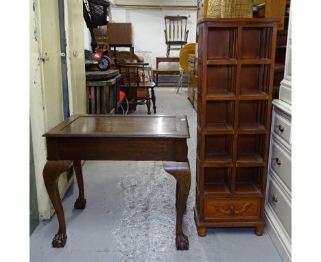 A rectangular oak lamp table, on cabriole legs, and a narrow stained wood open bookcase 