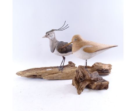 A carved and painted wood sandpiper sculpture, by Geoffrey Bickley, and a ceramic and metal sculpture of a lapwing with indis