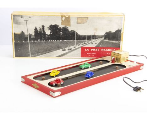 A Jouet Vibro 'La Piste Magique' Racing Set, comprising wooden base with tinplate 'Esso Service' station hiding electric moto