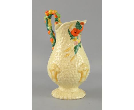 Clarice 'Celtic Harvest' jug, with raised wheat sheaf and flower ornamentation and fruiting vine handle, stamped underneath C