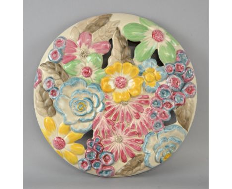 Clarice Cliff wall charger relief moulded and pierced with flower heads in bright colours 34cm diameter 