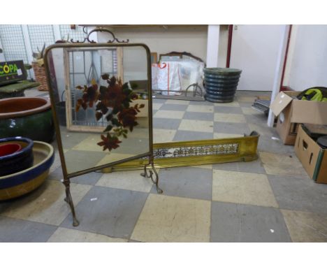 A Victorian brass fender and an Art Nouveau brass and mirrored glass fire screen 