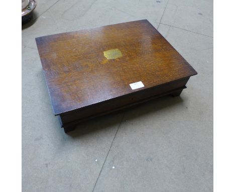 An oak cased E.P.N.S canteen of cutlery with faux ivory handles 