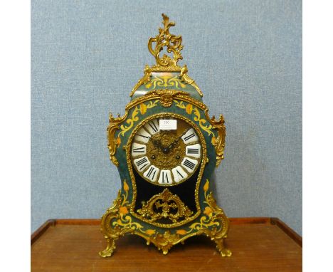 A French Boulle style gilt metal and simulated inlaid mantel clock 