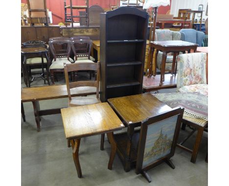 A Victorian elm kitchen chair, two oak occasional tables, a firescreen and an oak open bookcase 