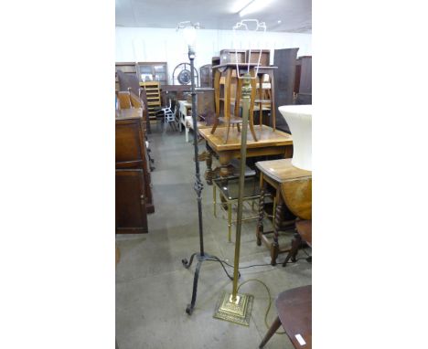 A brass Corinthian column standard lamp and a wrought steel standard lamp 