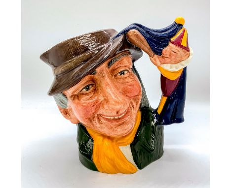 Brown hat; green coat; yellow scarf. Coming to England in the 17th century by way of Italy and France, the Punch and Judy pup