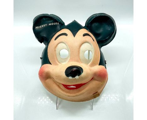 Vintage plastic Mickey mask with eye, nose, and mouth holes. Elastic string on backand "Mickey Mouse" name on ear in white. D