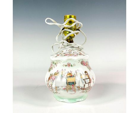 A lovely porcelain lamp decorated with illustrations featuring a mice family seated around the dining table drinking tea. Roy